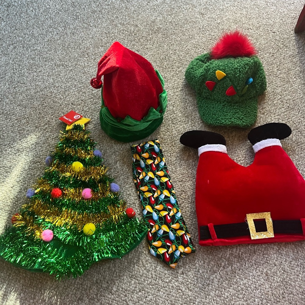 Collection of four Christmas hats and a tie. Excellent used condition.